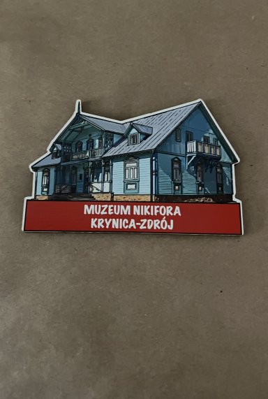 Magnes na którym widoczna jest praca Nikifora.