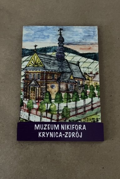 Magnes na którym widoczna jest praca Nikifora.